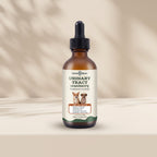 An amber glass dropper bottle of Care4Allom Urinary Tract Cranberry Treatment for Dogs, displayed on a beige surface with soft leaf shadows.